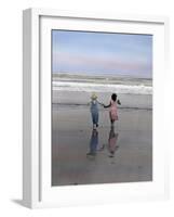 Boy and Girl on at Edge of Ocean Running and Holding Hands.-Nora Hernandez-Framed Giclee Print