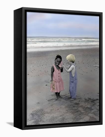 Boy and Girl on Beach Listening to Sea Shell-Nora Hernandez-Framed Stretched Canvas