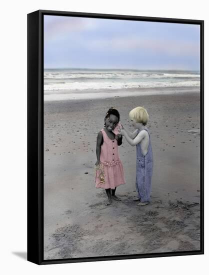 Boy and Girl on Beach Listening to Sea Shell-Nora Hernandez-Framed Stretched Canvas