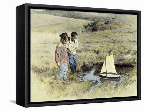 Boy and Girl Playing with Sail Boat-Nora Hernandez-Framed Stretched Canvas