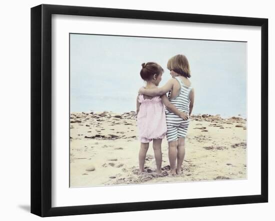 Boy and Girl with their Arms around Each Other on the Beach-Nora Hernandez-Framed Giclee Print