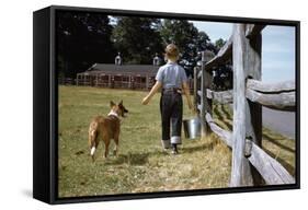 Boy and His Dog Walking Along a Fence-William P. Gottlieb-Framed Stretched Canvas