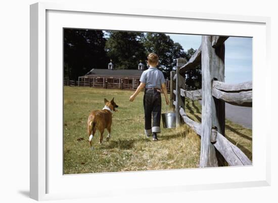 Boy and His Dog Walking Along a Fence-William P. Gottlieb-Framed Photographic Print