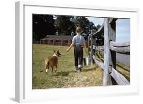 Boy and His Dog Walking Along a Fence-William P. Gottlieb-Framed Photographic Print