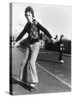 Boy Balances on His Skateboard with a Look of Concentration on His Face-Gill Emberton-Stretched Canvas