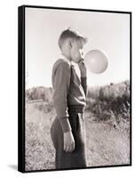 Boy Blowing a Balloon-Philip Gendreau-Framed Stretched Canvas