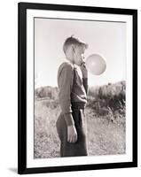 Boy Blowing a Balloon-Philip Gendreau-Framed Photographic Print