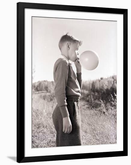 Boy Blowing a Balloon-Philip Gendreau-Framed Photographic Print