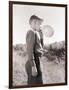 Boy Blowing a Balloon-Philip Gendreau-Framed Photographic Print