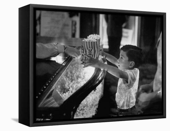 Boy Buying Popcorn at Movie Concession Stand-Peter Stackpole-Framed Stretched Canvas