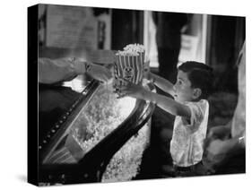 Boy Buying Popcorn at Movie Concession Stand-Peter Stackpole-Stretched Canvas