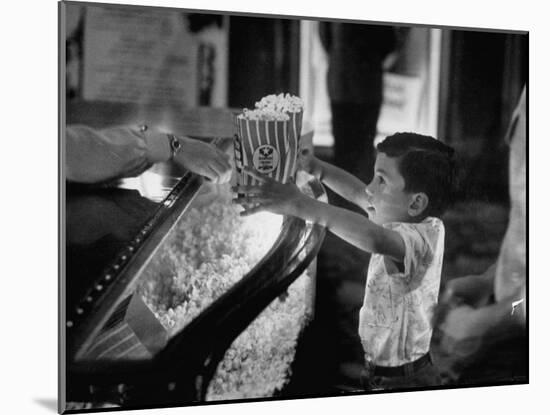 Boy Buying Popcorn at Movie Concession Stand-Peter Stackpole-Mounted Photographic Print