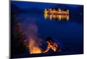 Boy Cooking at Twilight by the Jal Mahal Floating Lake Palace, Jaipur, Rajasthan, India, Asia-Laura Grier-Mounted Photographic Print