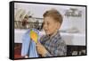 Boy Drying Serving Spoon-William P. Gottlieb-Framed Stretched Canvas