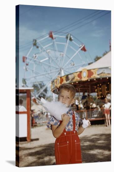 Boy Eating Cotton Candy at Fair-William P. Gottlieb-Stretched Canvas