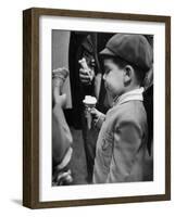 Boy Eating Ice Cream Cone at the Circus in Madison Square Garden-Cornell Capa-Framed Photographic Print