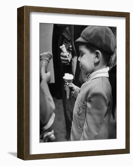Boy Eating Ice Cream Cone at the Circus in Madison Square Garden-Cornell Capa-Framed Photographic Print