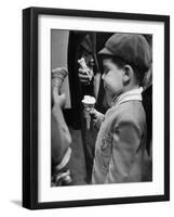 Boy Eating Ice Cream Cone at the Circus in Madison Square Garden-Cornell Capa-Framed Photographic Print