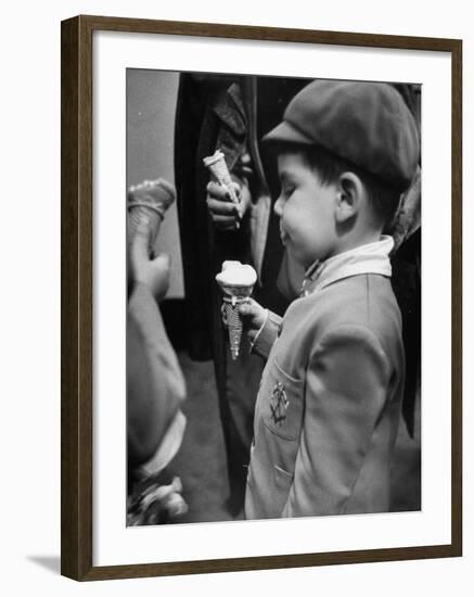 Boy Eating Ice Cream Cone at the Circus in Madison Square Garden-Cornell Capa-Framed Photographic Print