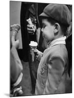 Boy Eating Ice Cream Cone at the Circus in Madison Square Garden-Cornell Capa-Mounted Photographic Print