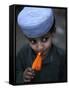 Boy Eats an Ice Lolly in a Neighborhood on the Outskirts of Islamabad, Pakistan-null-Framed Stretched Canvas