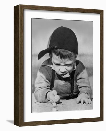 Boy Engrossed in Playing Migs-null-Framed Photographic Print