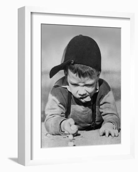 Boy Engrossed in Playing Migs-null-Framed Photographic Print
