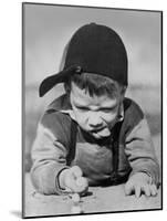 Boy Engrossed in Playing Migs-null-Mounted Photographic Print