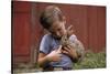 Boy Feeding a Rabbit-William P. Gottlieb-Stretched Canvas