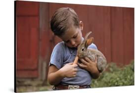 Boy Feeding a Rabbit-William P. Gottlieb-Stretched Canvas