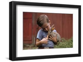 Boy Feeding a Rabbit-William P. Gottlieb-Framed Photographic Print