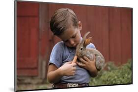 Boy Feeding a Rabbit-William P. Gottlieb-Mounted Photographic Print
