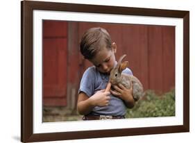 Boy Feeding a Rabbit-William P. Gottlieb-Framed Photographic Print