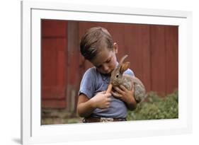 Boy Feeding a Rabbit-William P. Gottlieb-Framed Photographic Print