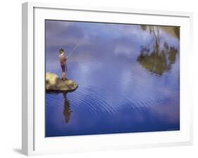 Boy Fishing from a Rock on a Pond-null-Framed Photographic Print
