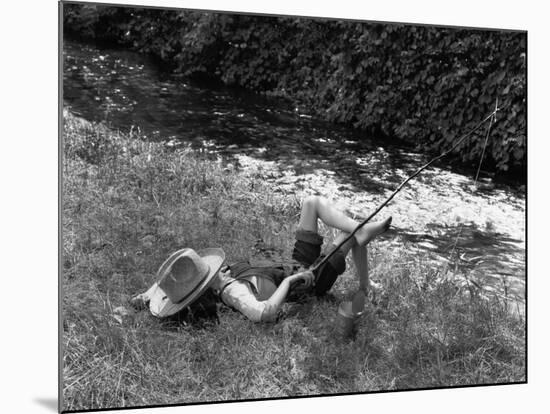 Boy Fishing with Hat Over Face-Bettmann-Mounted Photographic Print