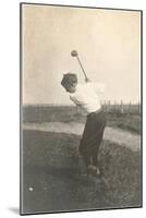 Boy Golfing in Field-null-Mounted Art Print