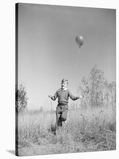 Boy Holding a Balloon-Philip Gendreau-Stretched Canvas