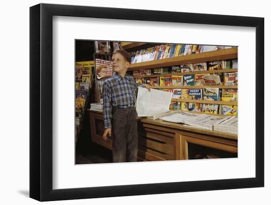 Boy Holding Paper in Newsstand-William P. Gottlieb-Framed Photographic Print