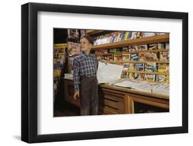 Boy Holding Paper in Newsstand-William P. Gottlieb-Framed Photographic Print