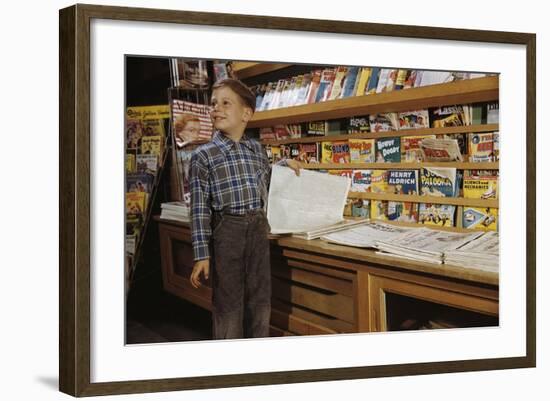 Boy Holding Paper in Newsstand-William P. Gottlieb-Framed Photographic Print