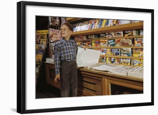 Boy Holding Paper in Newsstand-William P. Gottlieb-Framed Photographic Print