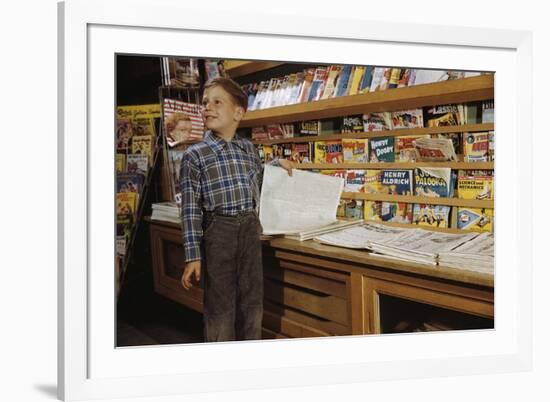 Boy Holding Paper in Newsstand-William P. Gottlieb-Framed Photographic Print