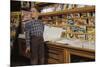 Boy Holding Paper in Newsstand-William P. Gottlieb-Mounted Photographic Print