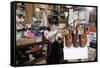 Boy Holding Shotgun in Sporting Goods Store-William P. Gottlieb-Framed Stretched Canvas