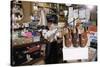 Boy Holding Shotgun in Sporting Goods Store-William P. Gottlieb-Stretched Canvas