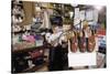 Boy Holding Shotgun in Sporting Goods Store-William P. Gottlieb-Stretched Canvas
