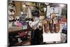 Boy Holding Shotgun in Sporting Goods Store-William P. Gottlieb-Mounted Photographic Print