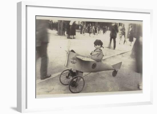 Boy in a Toy Aircraft-null-Framed Photographic Print