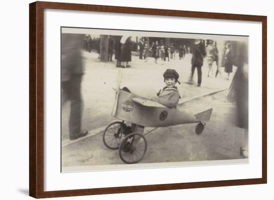 Boy in a Toy Aircraft-null-Framed Photographic Print